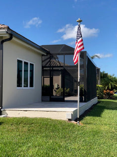 The 12-foot Greyline DX Flagpole of KC4OS in Naples, Florida -- still standing after Hurricane Milton's 120 mph winds