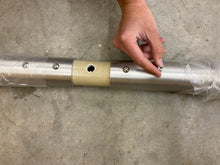 Load image into Gallery viewer, Fastening the section bolts on a Greyline HF vertical antenna; the 316 marine kit replaces them for salt air