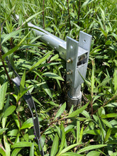 Load image into Gallery viewer, Greyline Tilt-Up Base close-up at N3EQF in Florida, showing the pivot plates and Grade 5 hardware on a 24 ft DX Flagpole