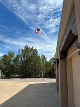 Load image into Gallery viewer, Skyline 33 fully dressed at W7MNE: 24 ft Greyline flagpole antenna flying the American flag, with the 9 ft DX Whip mounted above the working flag light and the halyard and cleat on the pole