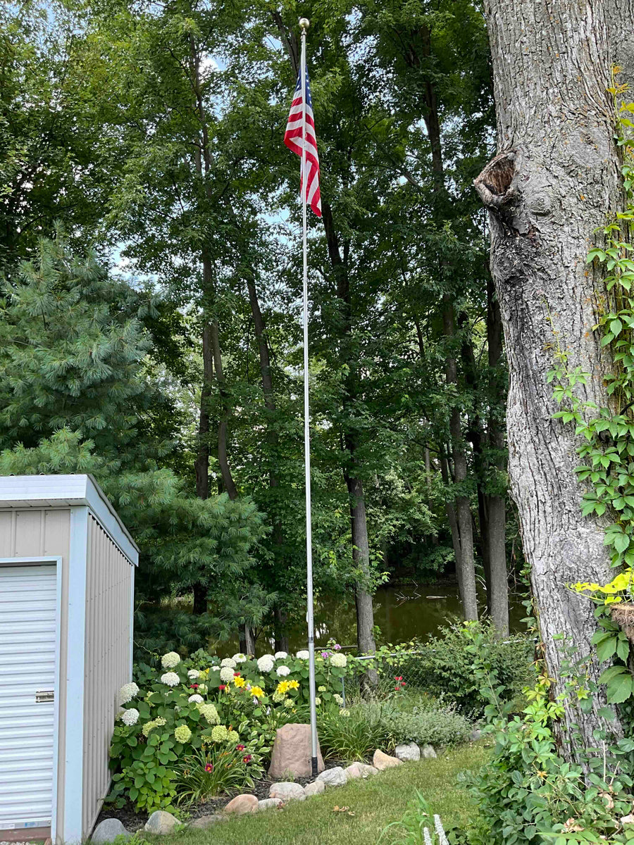The 28-foot Greyline DX Flagpole Antenna installed at the Ohio home of WB8UIN, showcasing its elegant design and powerful performance.